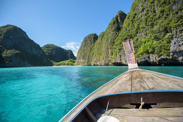 View of thai traditional longtail Boat over clear sea and sky in the sunny day, Phi phi Islands, Thailand